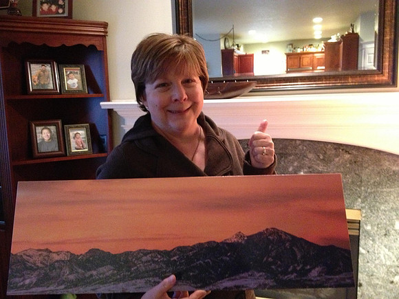 Mary Anne F. with her 10x30" canvas of the Bridger Mountains